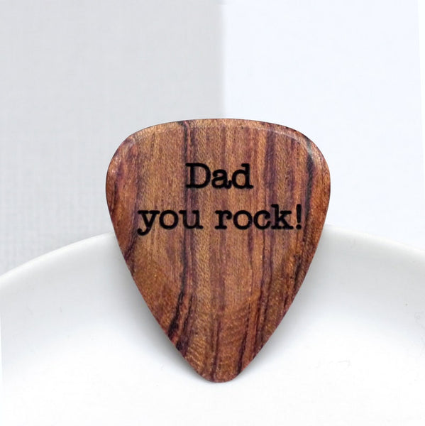 A simple wooden guitar plectrum, customised with your choice of words.